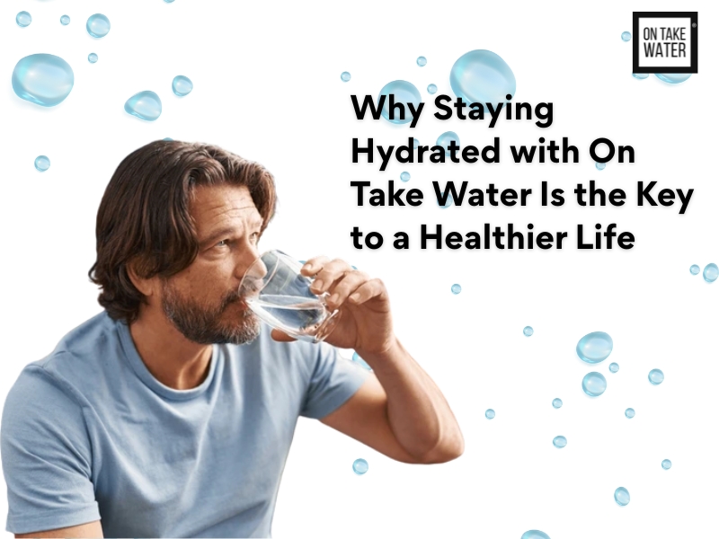 A man in a light blue shirt drinking a glass of water with water droplets in the background. Text on the image reads, “Why Staying Hydrated with On Take Water Is the Key to a Healthier Life.”