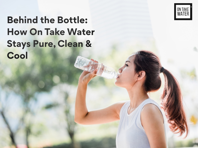 A young woman drinks bottled water on a sunny day, showcasing the purity and freshness of On Take Water.