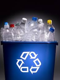 "Blue recycling bin filled with used plastic water bottles, promoting sustainable On Take Water bottle recycling."