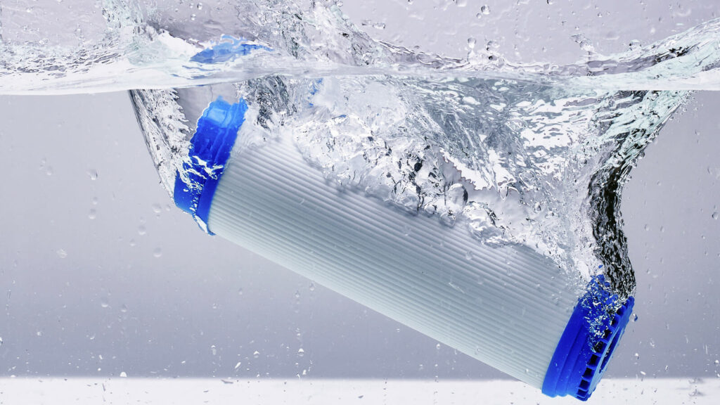 "High-performance On Take Water filtration cartridge submerged in clear water, showcasing advanced purification technology for clean and safe drinking water"

