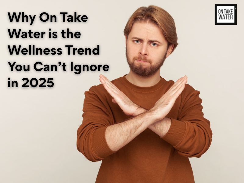 Man crossing arms with serious expression, highlighting Why On Take Water is the wellness trend you can’t ignore in 2025.